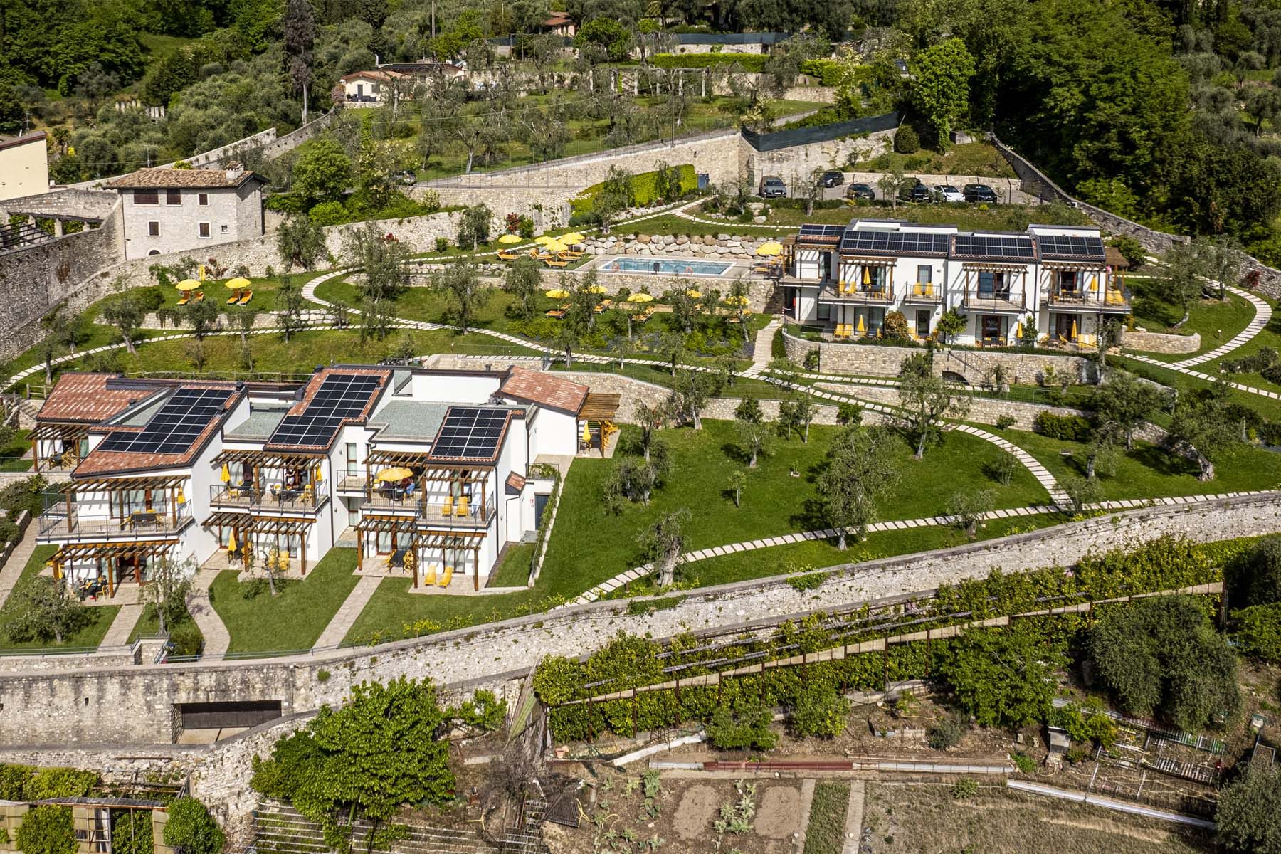 Hillside eco resort with solar panels, pool and olive trees